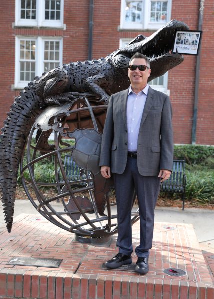 Mike Carrillo with GUS sculpture.