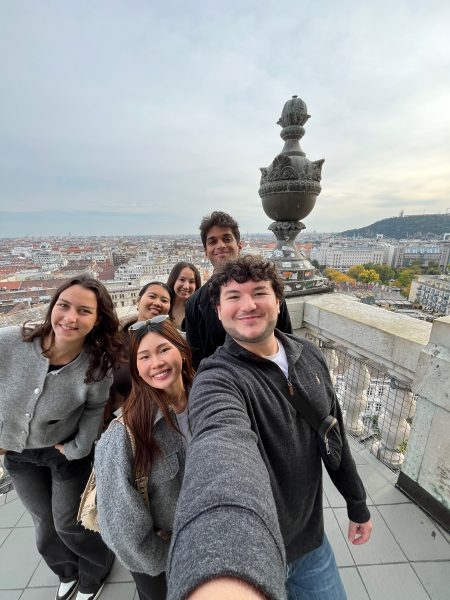 A group of students post on a balcony in Budapest, Hungary.