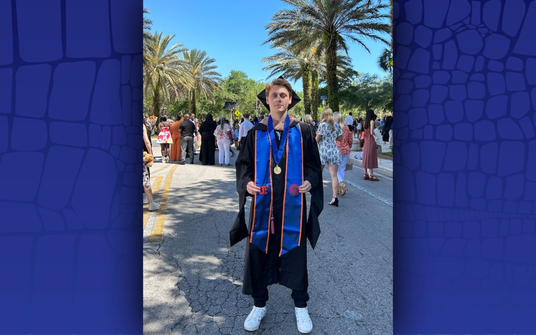 Eliott Wahba in graduation regalia.