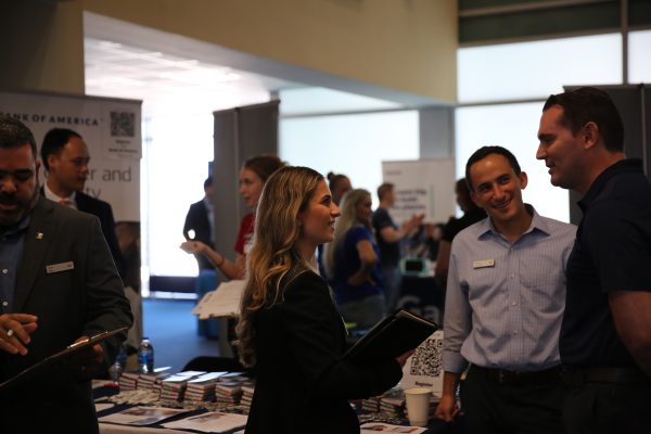 A group of people stand together at a career fair- Bank of America