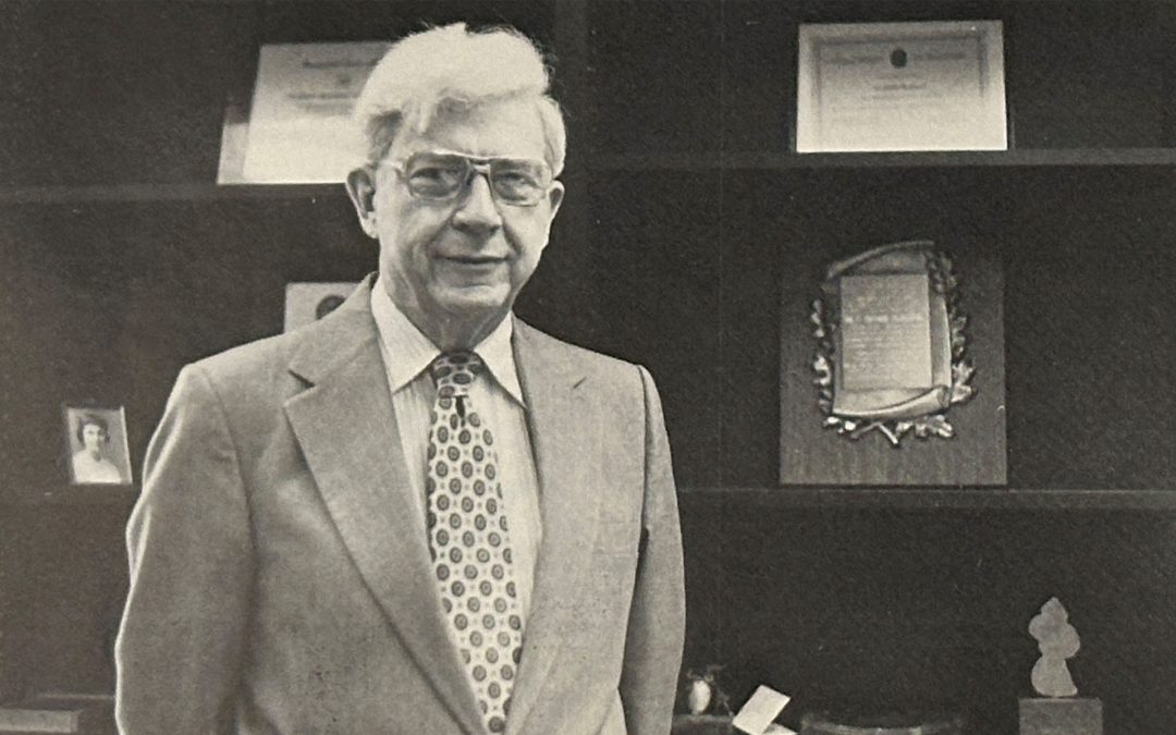 Dr. C. A. Matthews poses with awards.