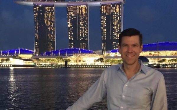 Rob Cornella stands in front of the Marina Bay Sands resort in Singapore.