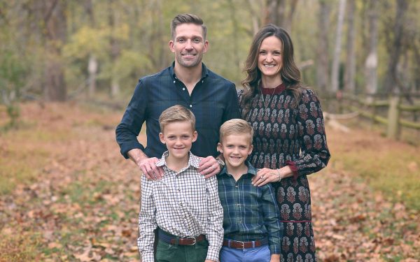 Michael Peerson and Sarah Peerson pose for a photo with their two sons, around ages 7-9.