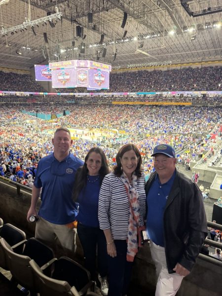 The Arsenault-Metz Family representing the Orange & Blue (from left): Mike Metz, Leslie Metz (BSBA ‘08, JD ‘12, MBA ‘22), Nancy Arsenault and Gerry Arsenault (BSAc ‘78). 