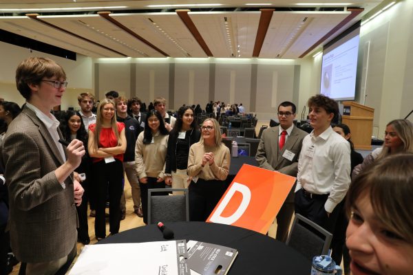 warrington welcome peer leader leading a table dicussion at professional summit