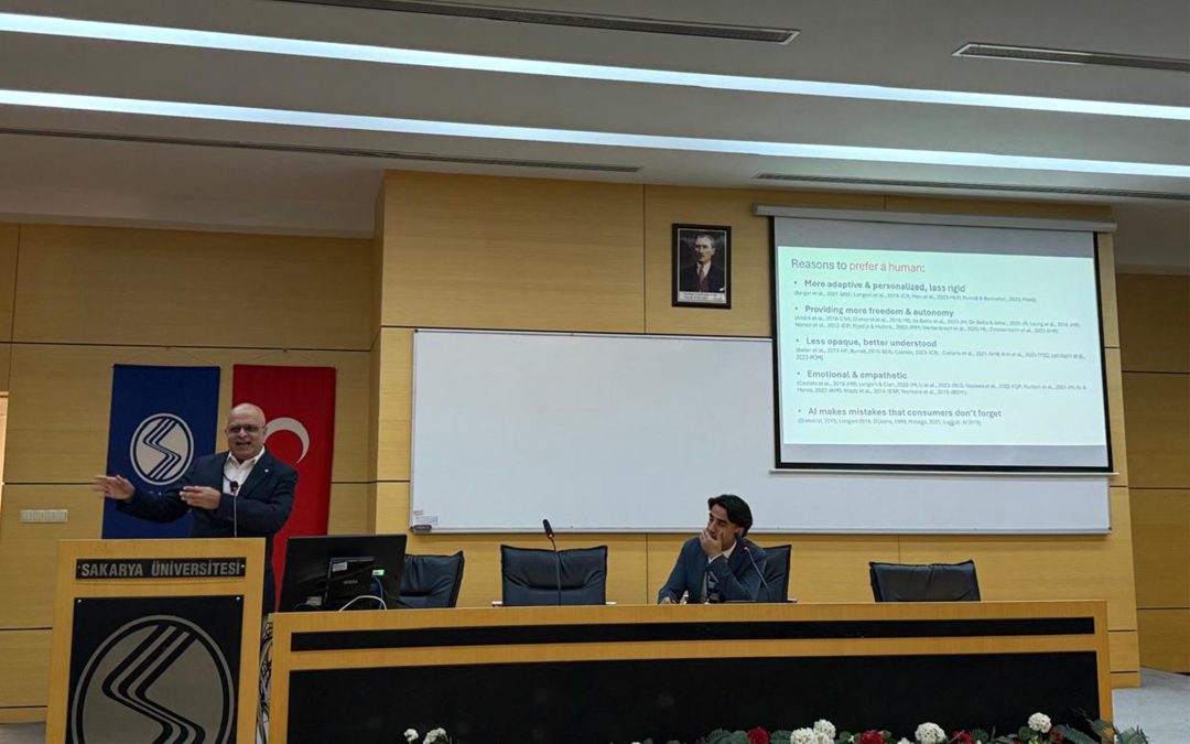 rahul banerjee presenting academic research paper behind a podium at gitma conference