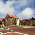 Hough and Gerson Halls. Large brick buildings in the background.